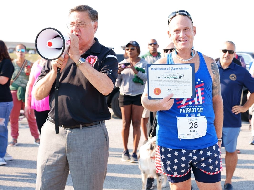Suffolk County Executive Ed Romaine (left) with Joseph Maiorana , President of the Library's board of trustees at a previous 5K Walk/Run for Literacy.