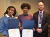 Niles North Seble Maru and Nahom Tekeste were honored for their contributions. Pictured with Principal Dr. Jim Edwards.