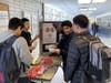 Students at Niles West visit an Informational booth to learn about healthy eating.