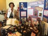 Mary Jo Anderson sets up Constitution Week display for Veterans Home.
