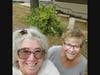 Diane and Diane work together clearing brush from head stones.