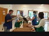 Many hands make light work to package 170 meals each week.