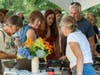 Joanie Cribben of West Falmouth shows off her pottery bowls at the Falmouth Art Center’s Pottery Show and Sale in 2021. This year’s sale is Saturday, July 30 from 10am to 2pm.