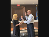 Council President Virigina East administering the oath to First Aid Squad Captain Gary Cummings