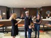 Council President Virigina East administering the oath to Fire Chief Tanner Shea.