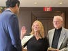 Councilwoman Viriginia East being sworn to another term as Council President by State Senator Vin Gopal.