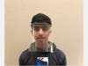 Quarry Lane student, Dhruv B., displays the face shield he constructed. 