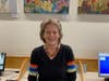 Priscilla in front of several of her paintings at the Newtown Square Public Library.