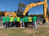The Big Dig Committee in front of some of the construction equipment that kids got to experience at the Ashbrook Corporate Center.