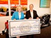 Supervisor Katrina Foley presents a $450K check to MOMS OC CEO Dave Lugo