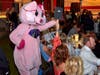 Piggie Bear high fives Comedy Night Gala attendees 
