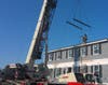 This crane helps lift the house for shipping.