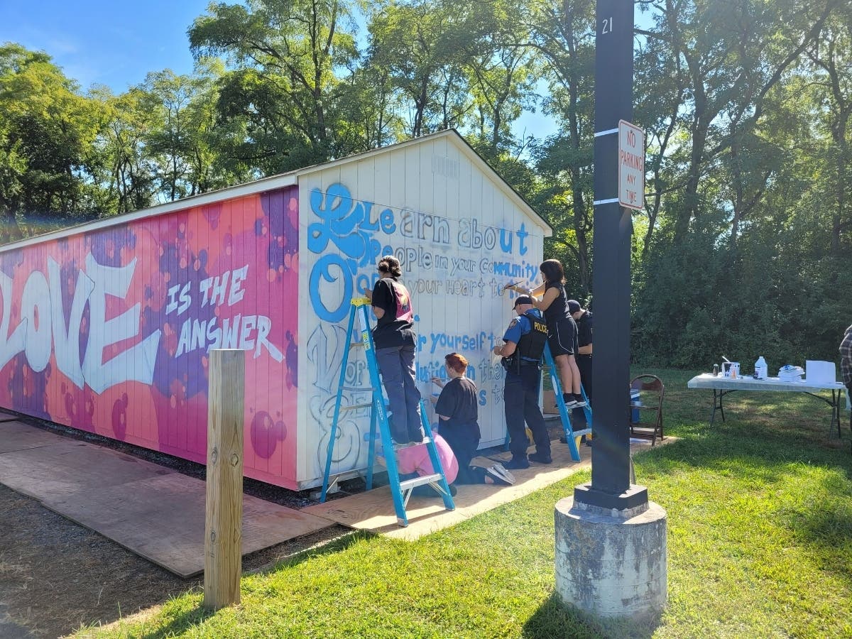 Falls Township police will join Pennsbury High students to paint a mural at Community Park Saturday.