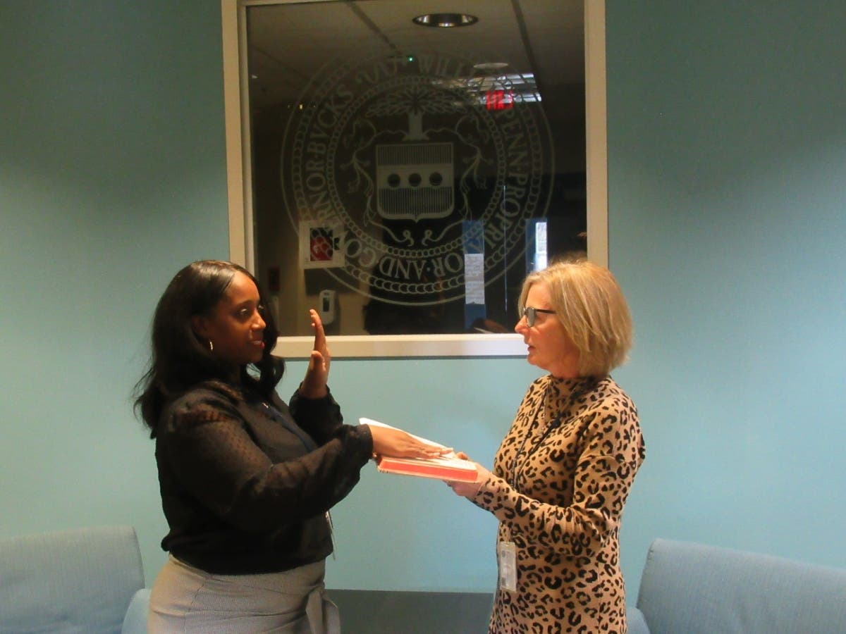 Bucks County Chief Deputy Coroner Danakelly Hampton gets sworn in by Coroner Meredith Buck.