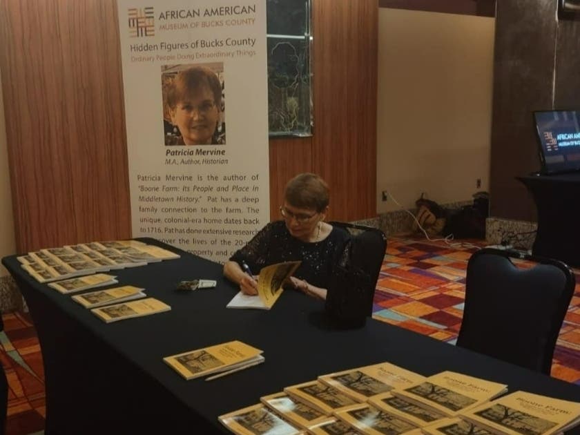 Author Patricia Mervine signs her book on Boone Farm at a gala at Parx Casino in early December.