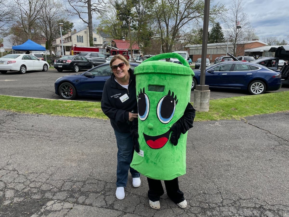 Hatboro Borough Manager Diane Hegele poses with Bindy at the borough's Earth Day celebration on Saturday.