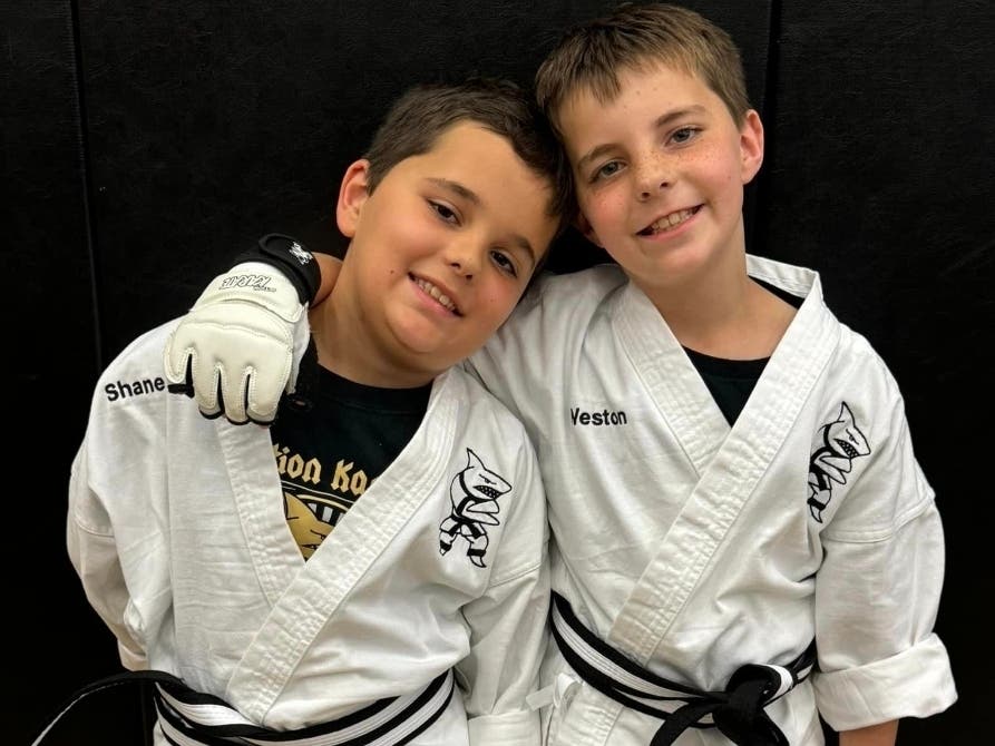 Twins Shane and Weston Fox, age 9, of Warrington, are pictured after they were awarded their junior black belts at Action Karate in Jamison.As part of the junior black belt process, the boys were asked to do a community service project.