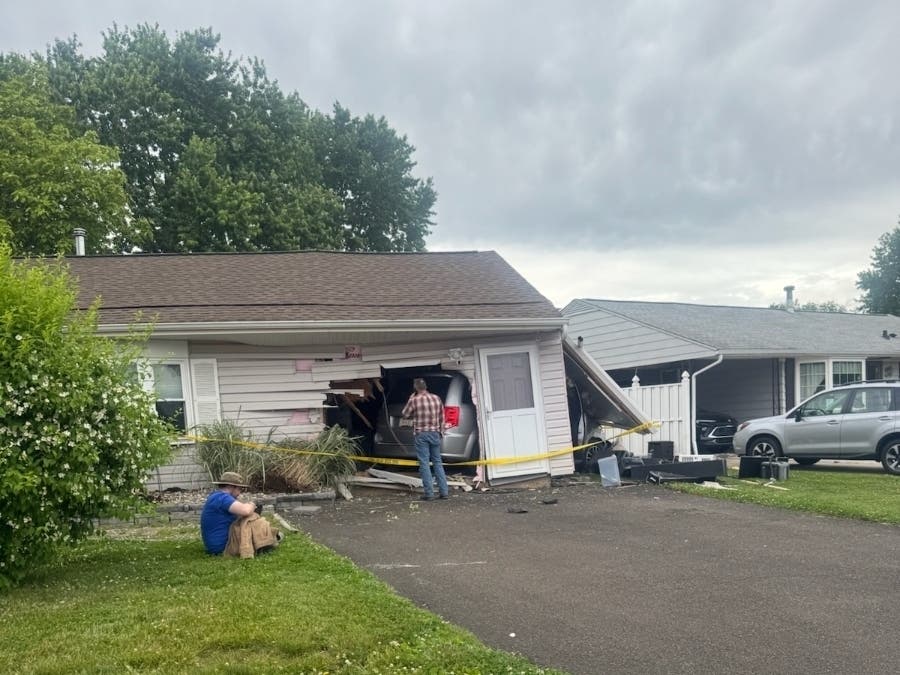 A driver crashed through a home in Falls Township on Friday afternoon, police said.
