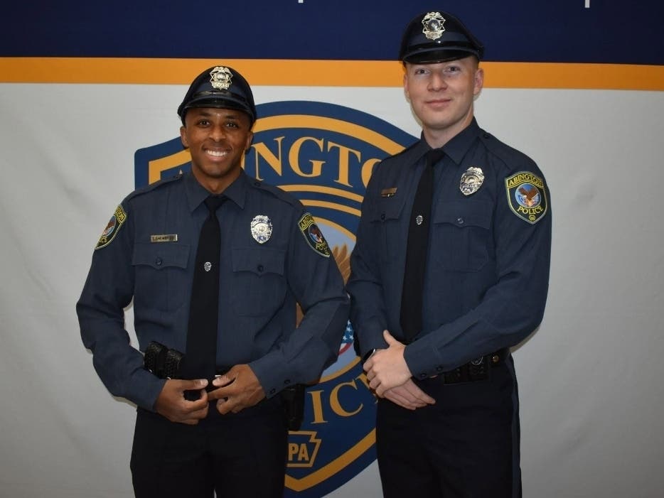 The two police officers were sworn in at the recent Abington Township Board of Commissioners meeting.
