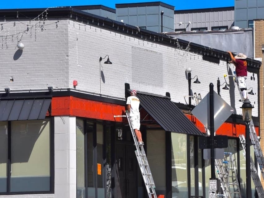 The former Ross & Co. building on South York Road is getting a fresh coat of paint as Iron Oven gets set to open.