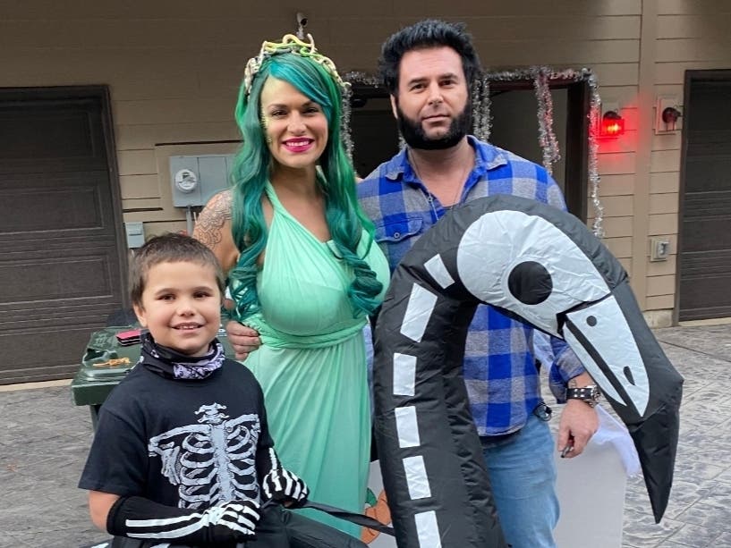 Kristin Kellam (center), her son, Mason Kellam (left, 3rd grader, Herndon Elementary), and her husband, Casey Kellam (right), share their Halloween spirit by coordinating a community food drive.
