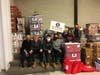 A small group of volunteers packed food for distribution to students at Herndon Middle and Herndon High.