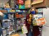 Kate Lauderdale, LJMS teacher and Food For Neighbors volunteer extraordinaire, stored donated food in the LJMS food pantry.