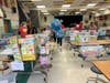 Then volunteers bring it to a collection area for sorting and delivery to schools.