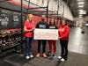 Food For Neighbors (FFN) celebrates its new partnership with CrossFit Reston, now owned and run by Samrina Islam and her family. Pictured R-L are Samrina Islam, daughter Jennah Whitehill, and  brother Shakil Islam with FFN Founder Karen Joseph.