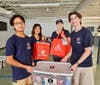 Members of the Young Men's Service League enjoy a morning of receiving and sorting food and toiletries bound for Belmont Ridge MS, Stone Hill MS, Riverside HS, and Stone Bridge HS.