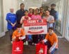 Amazon volunteers celebrate a day of service at Crossroads United Methodist Church in Ashburn. Amazon is a Food For Neighbors Community Champion and sponsor of the November Red Bag Event.
