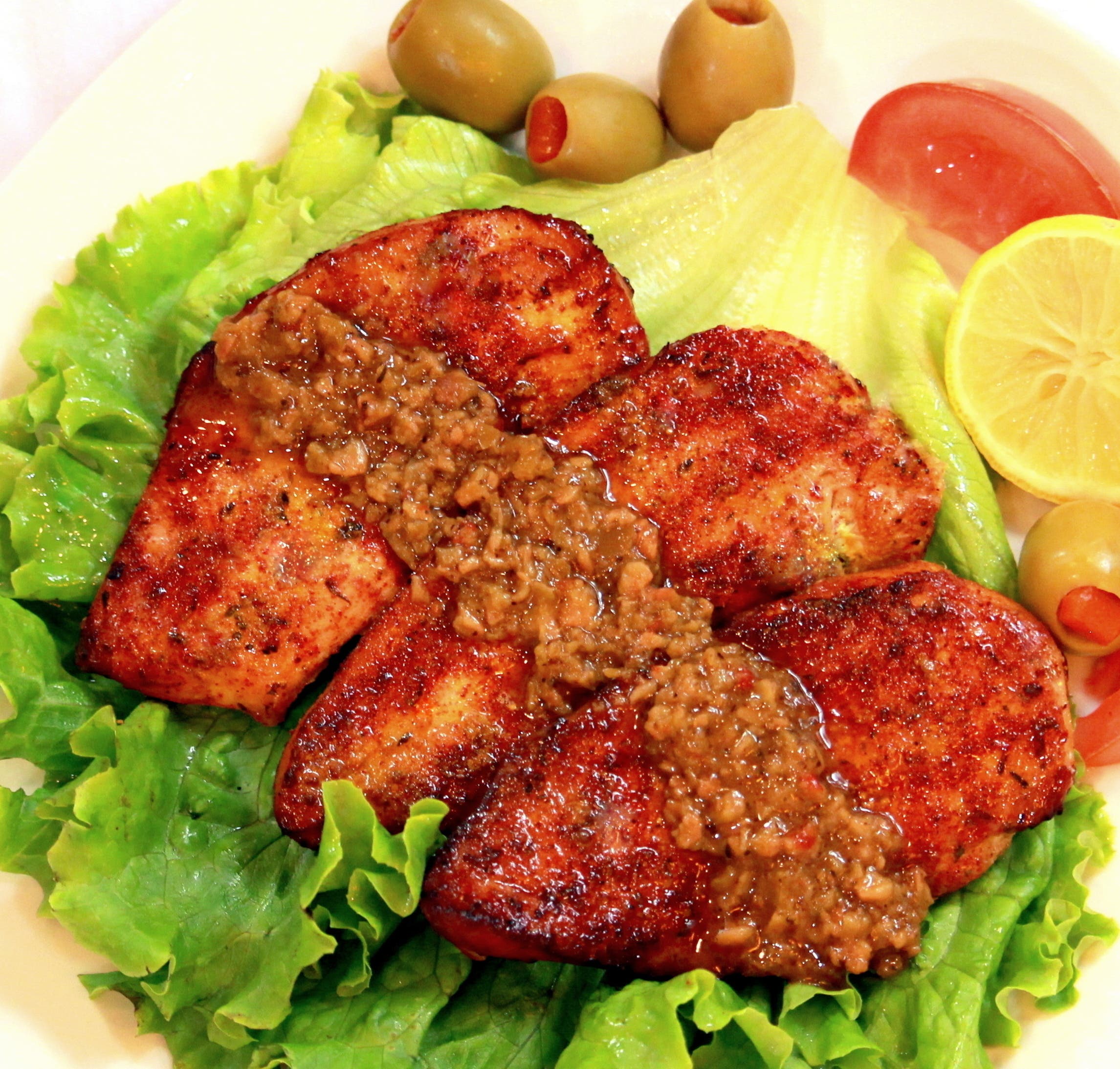 Mama Faiths' Olive Spread tapenade, perfect with meat, chicken, or fish