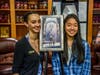 Elise with Illustrators of the Future winner, Aliya Chen, and the illustration for her story, "Untrained Luck."
