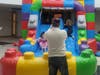 Kids enjoying the 17-foot tall, 30 foot long bounce house. 