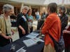 Attendees peruse items 