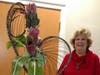 Ann C Lange created one of her exciting floral arrangements for a recent Andover Garden Club meeting.