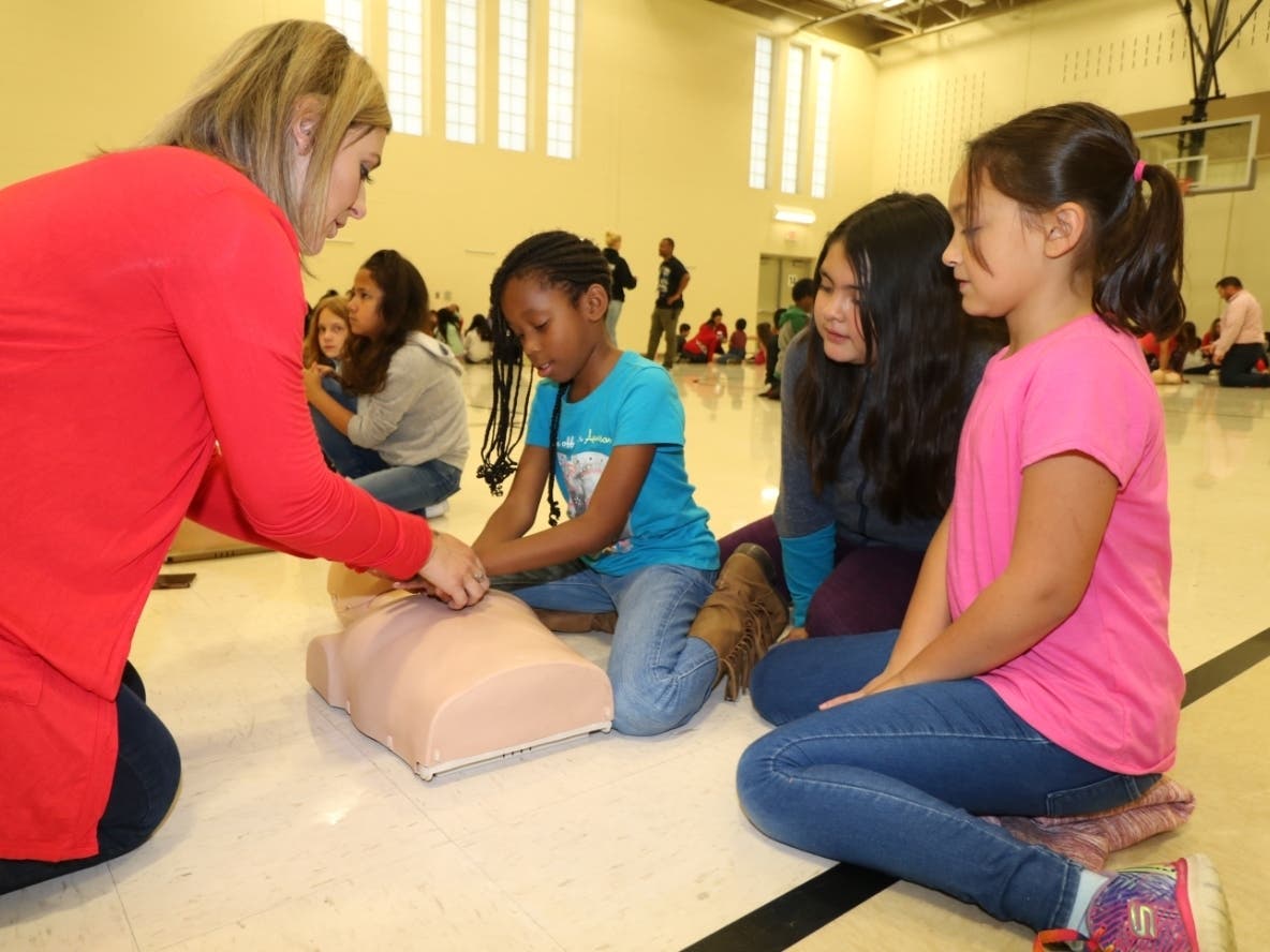 Students Ja'kyla Dean, Karen Moreno, Madison Schultz with instructor Stefani White from the American Heart Association