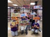 Nutrition Services workers from Hufford Junior High get creative with signage (front row, left to right) Anne Reavis, Donja Suarez, Kathy Beeson (Standing, from left to right) Mary Wietting, Becky Smith, Dar Sinovich, Andre Dudley, Karen Faciana