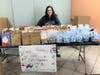 Taft Teacher Anne Flaherty delivers the socks to MorningStar Mission