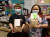 Fourth Grade Students Tyler Kleinschmidt and Savannah Draper share their decorated bags