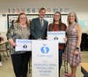 Superintendent Dr. Theresa Rouse, President of the Golden Apple Foundation Alan Mather, Chelsea Young, and Woodland Elementary School Principal Kim Gordon were part of the surprise announcement.