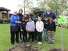 Rita Renwick, Joliet City Councilwoman Sherri Reardon, Dr. Theresa Rouse, "Twig" (Kristi Wright), Dr. Shawn Olson, and Sandburg students Demetris Gardner, Maite Alvarez, Victoria Ford, Marcos Valdovinos, and Deandre Davis take part in the celebration.