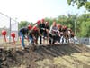 Superintendent Dr. Theresa Rouse and Gompers Junior High administrators join students to break ground at Gompers. 