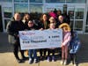 M.J. Cunningham Elementary School Principal Marysol Sandoval, Assistant Principal Kelley Ratajczak, staff, students, and parents from the Cunningham PTO receive an oversized $5,000 check at the grand opening. 