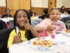 (from left to right) Five-year-old Kashmir Jones and six-year-old Kai Alexander enjoyed their pancakes and syrup. 