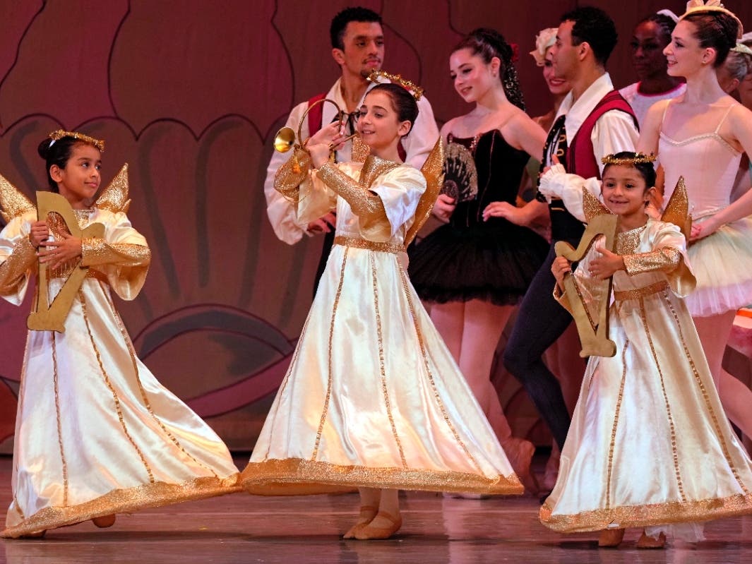 Young dancers perform as angels in the Land of Sweets in the 2025 New York Dance Theatre production of "The Nutcracker."