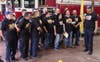 Capt. Borke (right) and Chief Piñero (third from right) with volunteer firefighters 