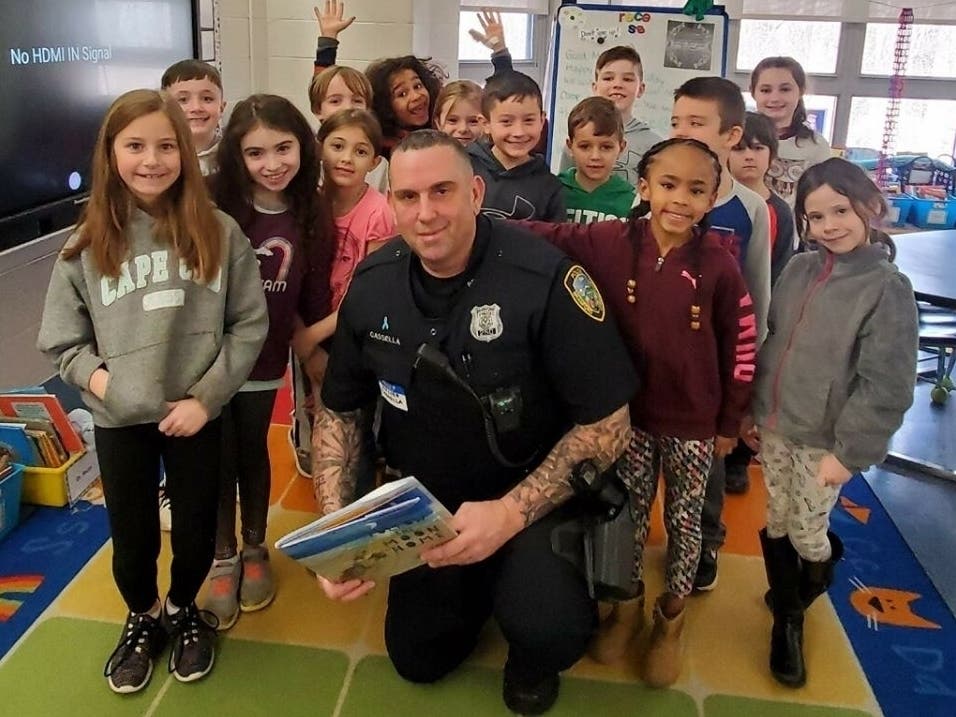 Who loved the book 'Follow the Moon Home' more? The second-graders or Branford Police officer John Cassella?