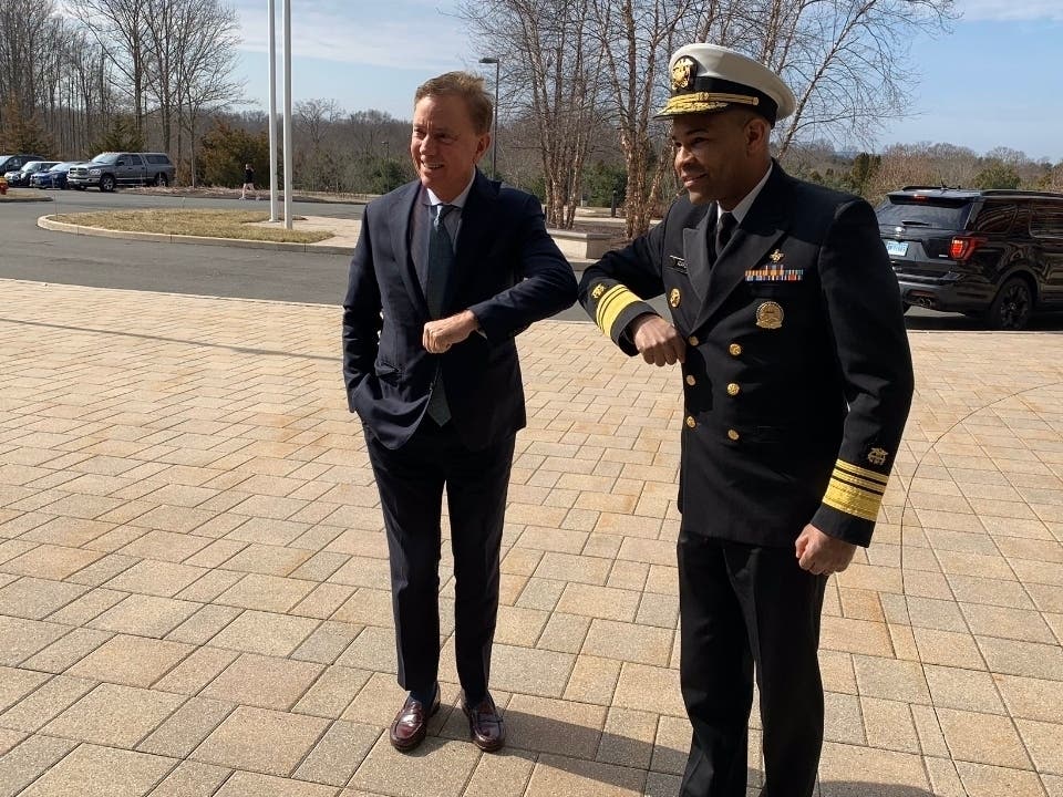 On March 2, Gov. Ned Lamont and U.S. Surgeon General Jerome Adam​s bump elbows to encourage people not to shake hands during the coronavirus pandemic.