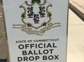 Absentee ballots may be mailed, or put in secure, official state ballot drop boxes at town hall. 